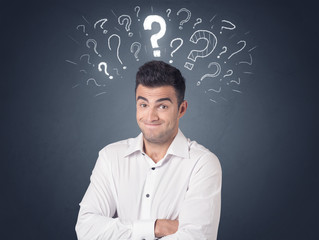 Young casual businessman with white question marks above his head