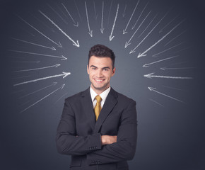 Young businessman with arrows pointing to his head 