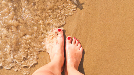 Feet on the beach.