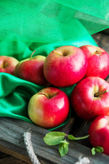 group of red apples on wooden natural background, fresh natural food and vitamins concept in rustic style