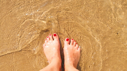 Feet on the beach.