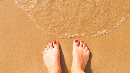Feet on the beach.