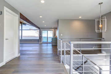 Spacious upstairs landing with gray walls