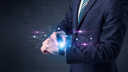 Man wearing smartwatch with networking concept on it.