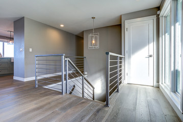 Spacious upstairs landing with gray walls