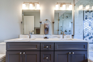 Luxury bathroom interior with blue dual washstand.