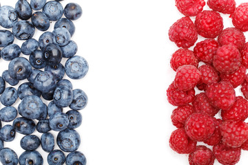 blueberry and raspberry berries isolated on white background