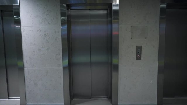 Modern elevator in a building. Elevator in office building. Closed elevator door on ground floor