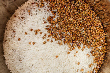 Top view of raw rice and buckwheat grain. Healthy food.