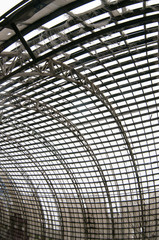 Old arched metal structure. Industrial geometry.