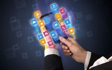 Female hand using smartphone with colorful angular fast switching application icons around