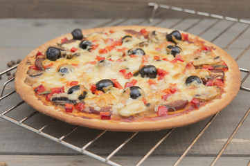 homemade pizza on a wooden table. 