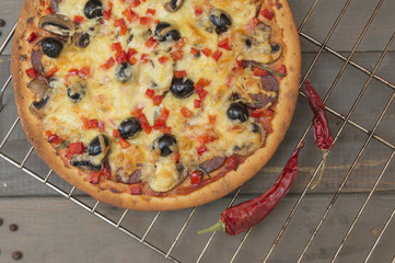 homemade pizza on a wooden table. 
