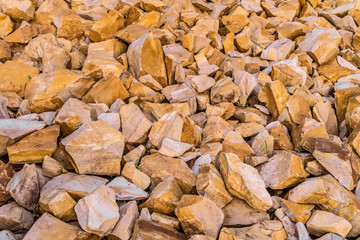 Brown decorative crushed stones for landscape design, decoration landscaping gardens and parks. Textural background of natural crushed marble.