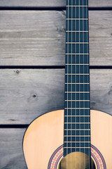 acoustic guitar on wooden ground