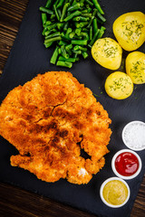 Fried pork chop, potatoes and green beans
