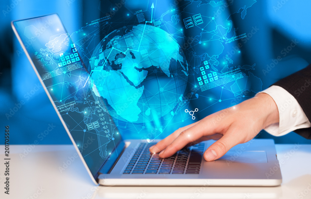 Poster hand using laptop with global reports and stock market change concept