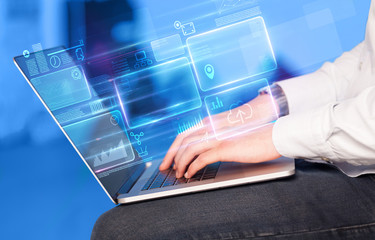 Hand using laptop with database reports and online work concept
