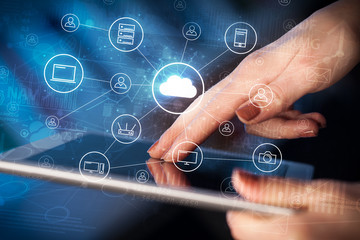 Businessman working on tablet with reports and graphs concept around
