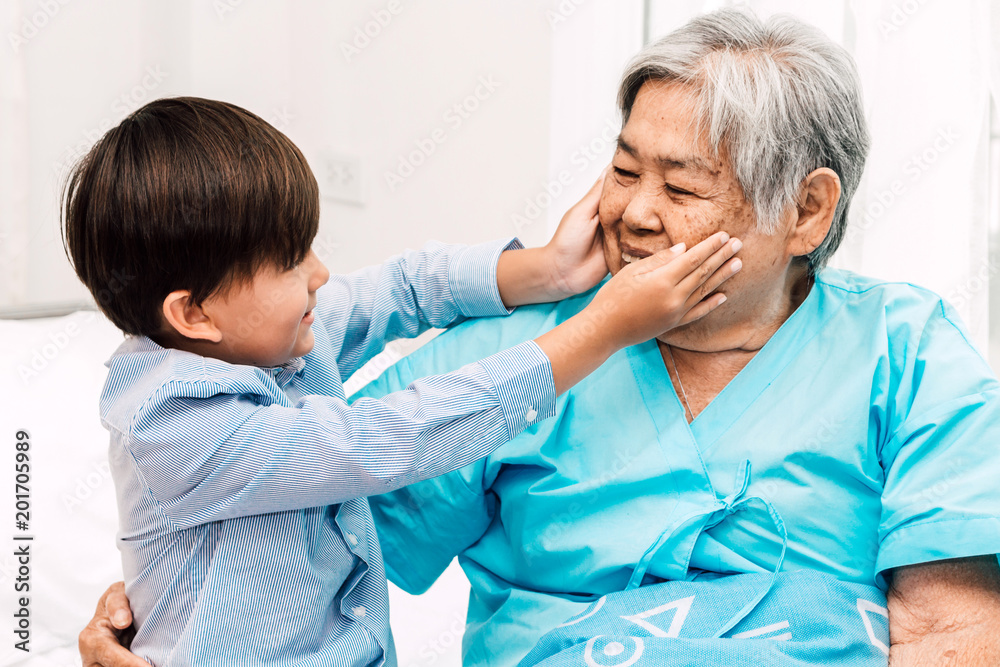 Wall mural portrait of happy elderly woman with little grandson smiling.relax family love people concept