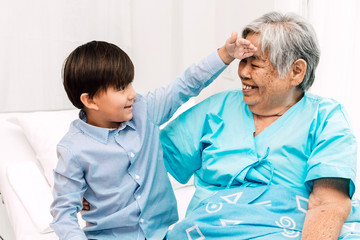 Portrait of happy elderly woman with little grandson smiling.relax family love people concept