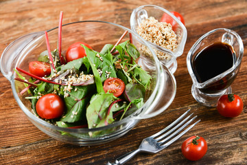 a salad of fresh greens and sesame seeds with soy sauce, Asian national cuisine