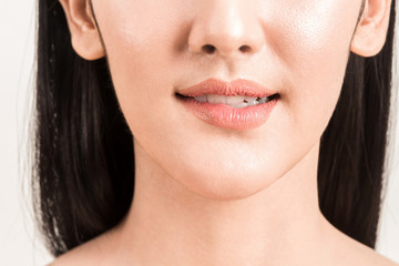Obraz premium Close-up of female lips mouth biting lip isolated on white background