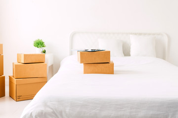 Pile of cardboard box on bed.SME business online and delivery concept