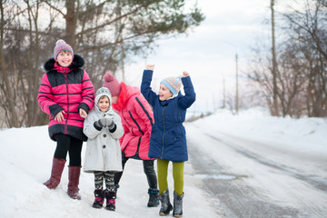 Fototapeta na wymiar Children playing during winter day