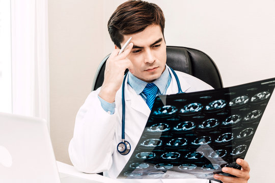 Doctor looking at x-ray photo in hospital.healthcare and medicine