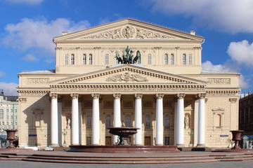 Moscow, Russia - Bolshoi (Big) theatre after reconstruction in spring on blue sky background with clouds