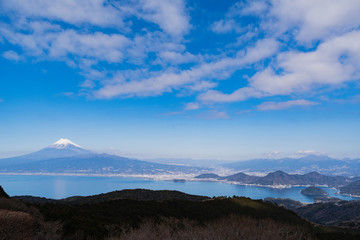 Hazy Mt. Fuji with Suruga bay from Darumayama of Izu peninsula in Japan at Spring. 