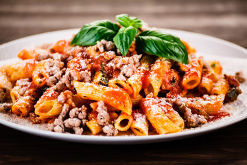 Penne with meat, tomato sauce and vegetables