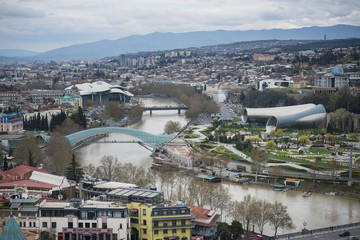 Cityscape of Tbilisi, the capital and the largest city of Georgia, lying on the banks of the Kura River. Its cobblestoned old town reflects a long, co