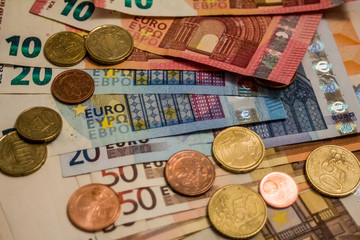 A composition of euro banknotes and coins providing great options to be used for illustrating subjects as business, banking, media, presentations etc.