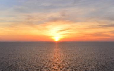 The sun shines brightly on a beautiful fall near the sea