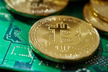 Stack of cryptocurrencies on motherboard. Bitcoin as most important cryptocurrency concept. 3D illustration