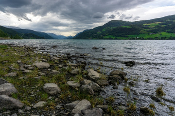 Fototapeta premium Lake stone mountain dark cloud