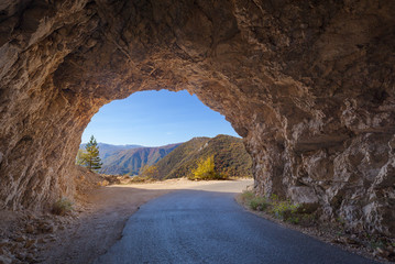Driving through old rocky tunnel in remote part of Montenegro