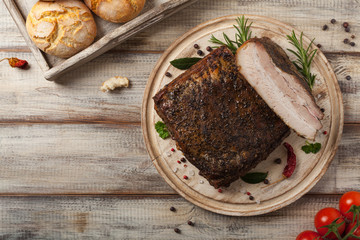 Baked whole pork bacon.
