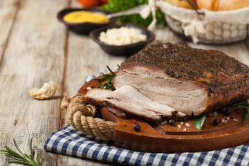 Baked whole pork bacon.