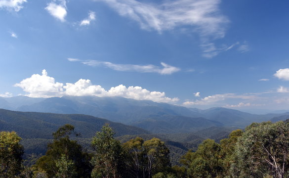 Broad panorama of the countryside in New South Wales with mountains. View from Snowy Surge Tower on Kosciusko Rd near Jindabyne, NSW, Australia.
