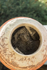 Construction site work with concrete mixer and wheelbarrows