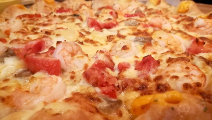 closeup pizza and cheese dip sauce