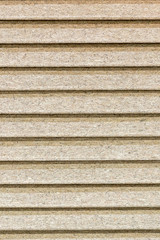 Closed blinds made of cork. background of a crooked tree in the form of blinds