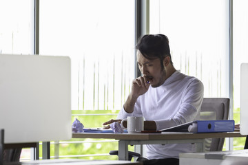 Young businessmen yawn because hard work.....