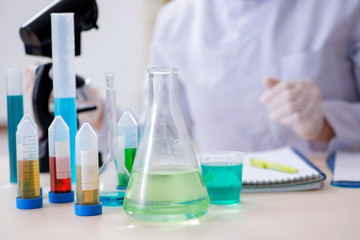 Woman chemist working in hospital clinic lab