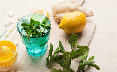 Making lemonade at home, ingredients on white wooden table