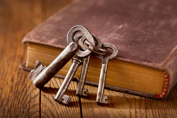 still life with old keys on a book
