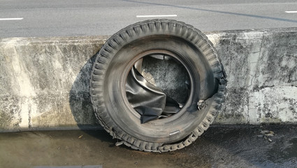 burst large car tire on the road